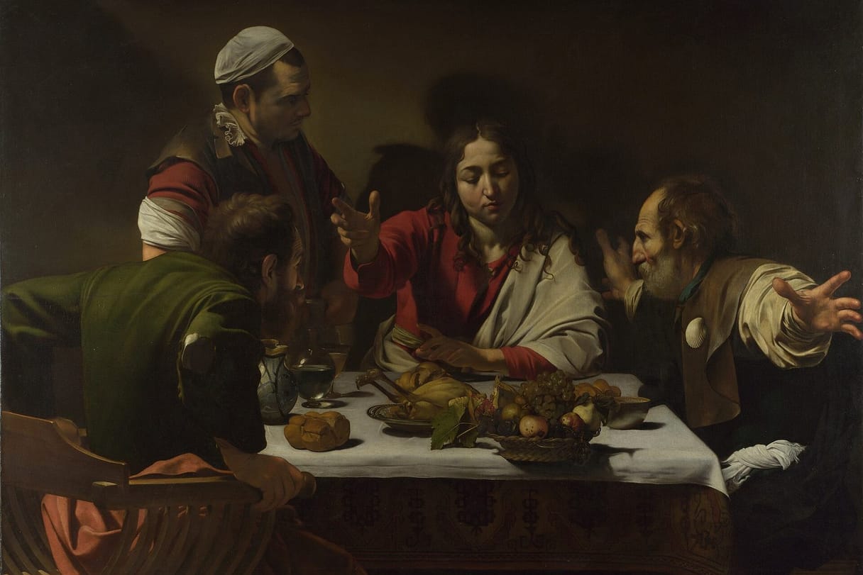 The risen Jesus blesses bread at an inn table while two startled disciples recognize him, one flinging his arms wide.