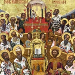 Rows of haloed bishops in patterned vestments sit in a semicircle around an open Gospel book set on a throne.