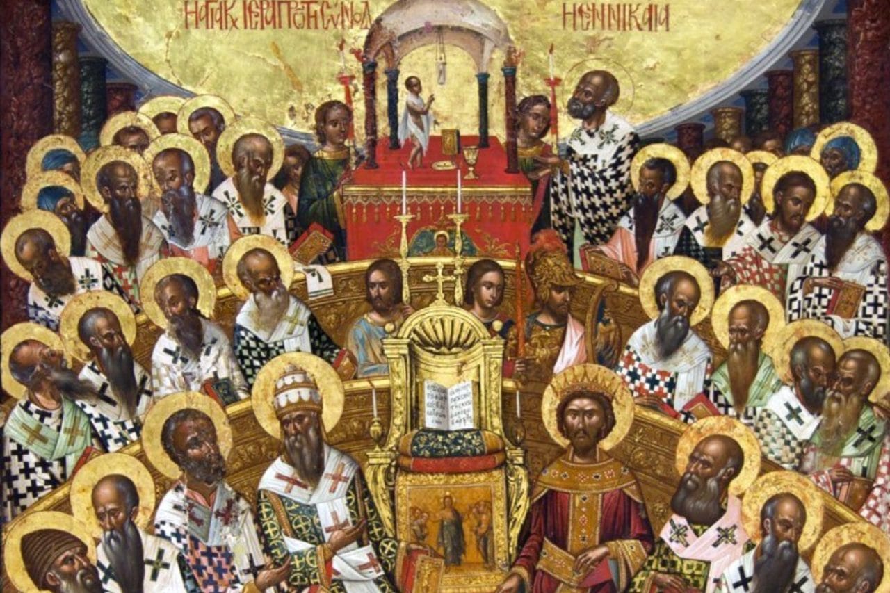 Rows of haloed bishops in patterned vestments sit in a semicircle around an open Gospel book set on a throne.