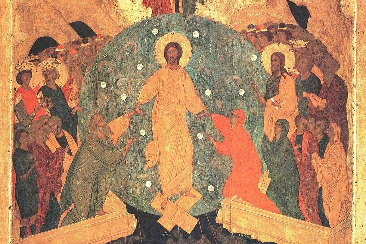 Christ, robed in gold within a blue-green circle of light, stands on the broken gates of hell and takes Adam and Eve by the wrists, while kings, prophets, and saints crowd in on either side.