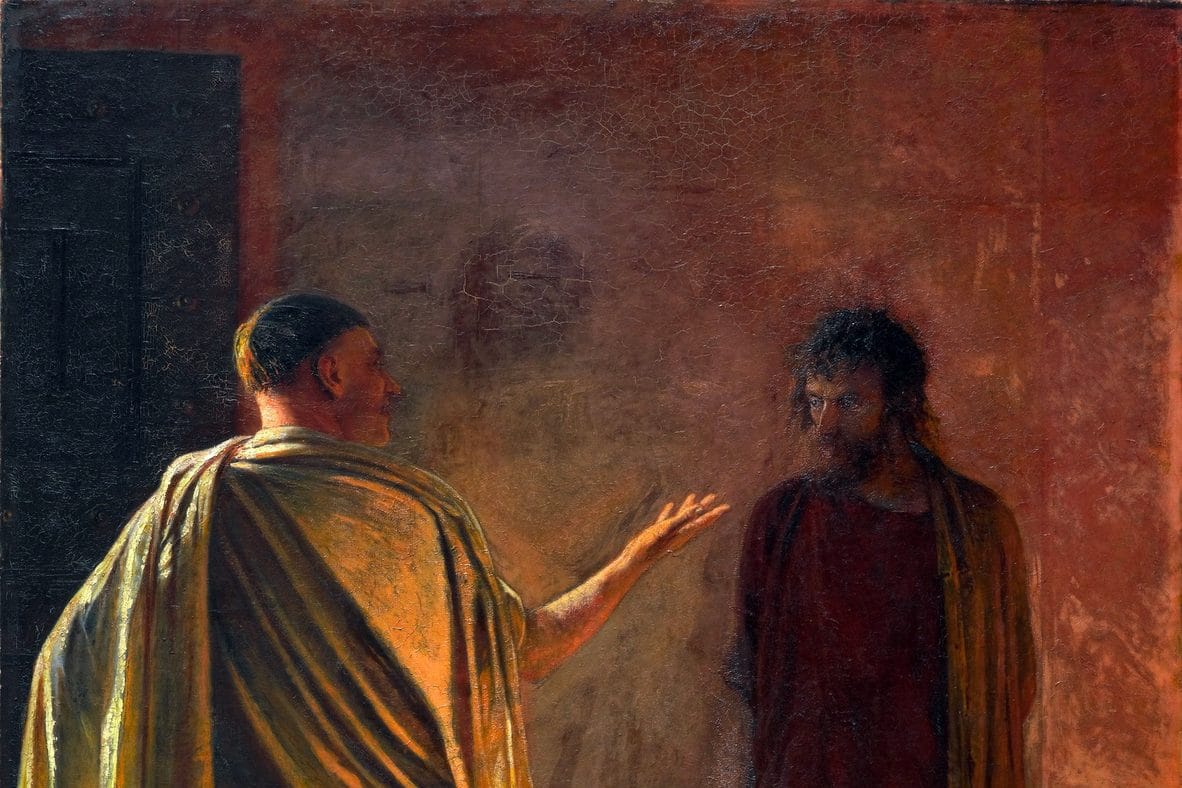 The Roman governor Pilate, in a pale toga, gestures toward Jesus, who stands silent in shadow against a wall.