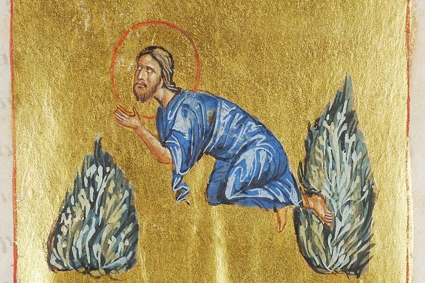 On a plain gold ground, Christ in a blue robe kneels between two silvery-green bushes, his hands lifted before his face in prayer.