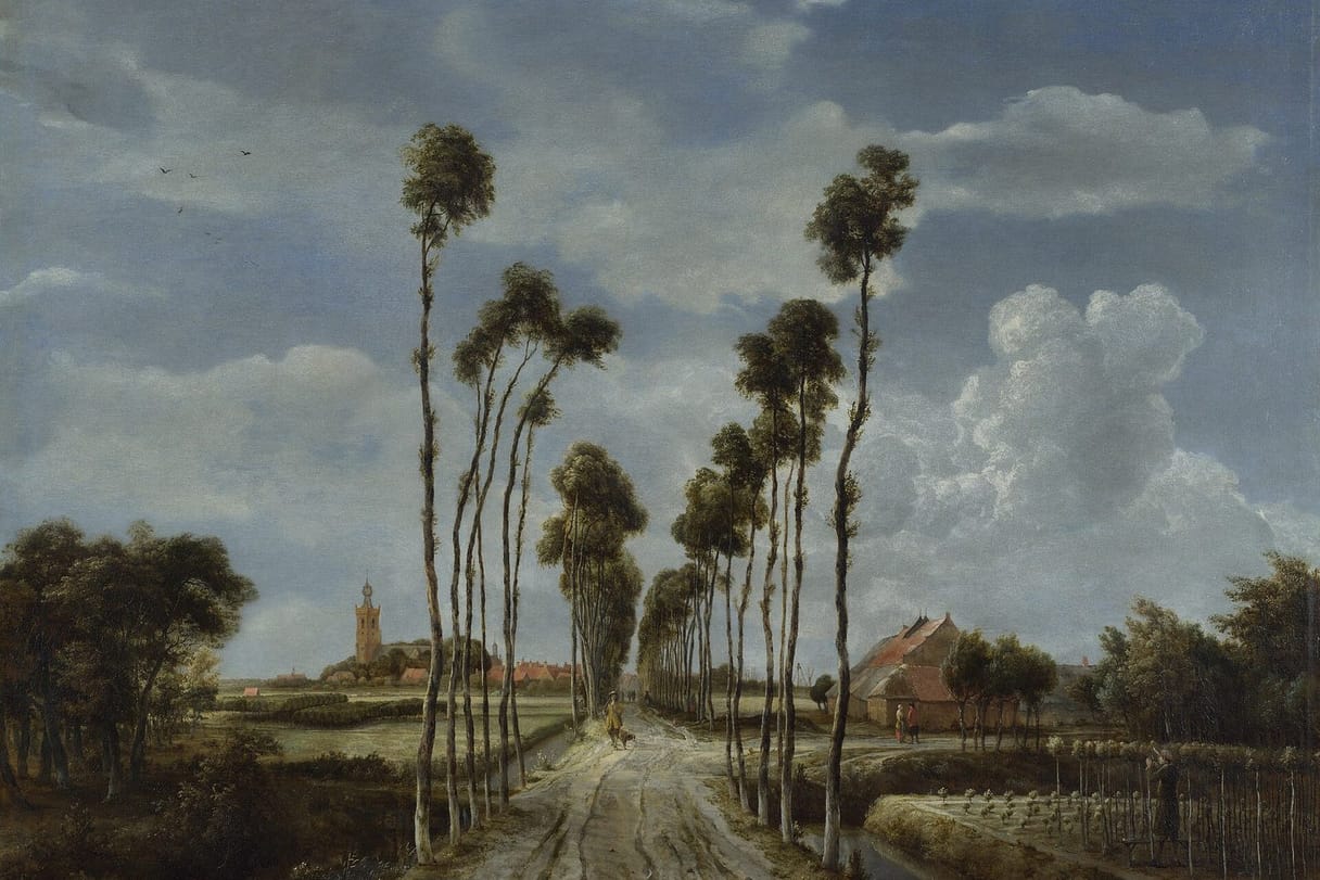 A straight country road lined with tall, thin trees runs toward a village church tower under a wide, cloudy Dutch sky, with a man and his dog walking along it.