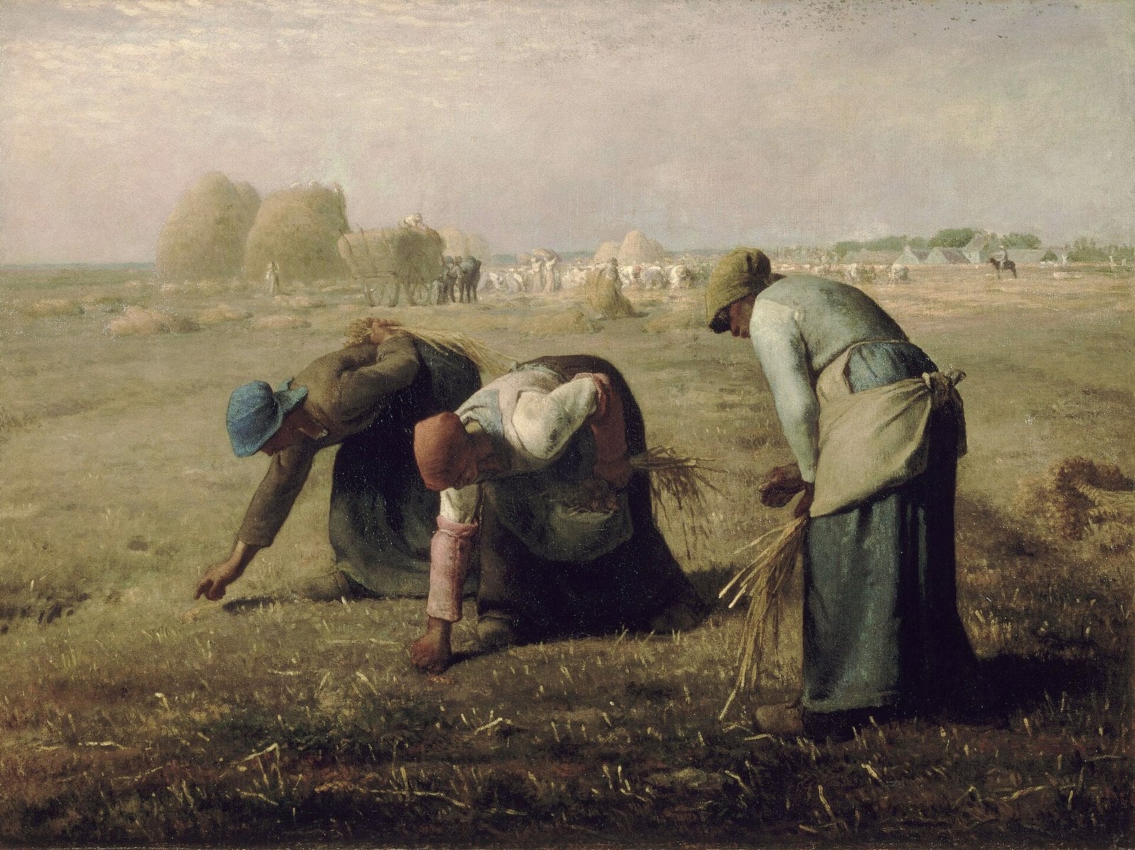 Three peasant women bend low in a harvested field to pick up stray stalks of grain, while haystacks and a busy harvest crew fill the distance.