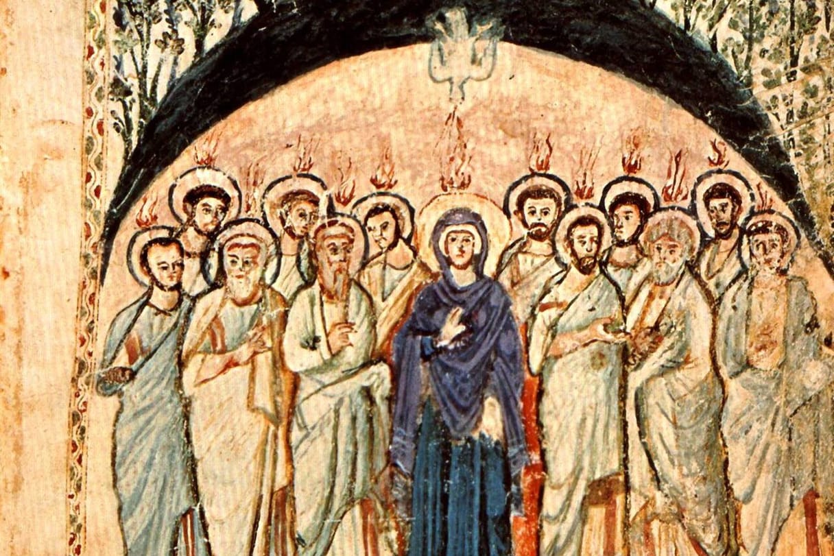 A white dove descends from the top of a dark arch as tongues of flame rest on the heads of the apostles and of Mary, who stands among them in a deep blue mantle.