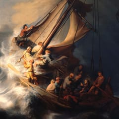 A small fishing boat pitches on a huge wave under a dark sky as the disciples struggle with the sail and ropes.