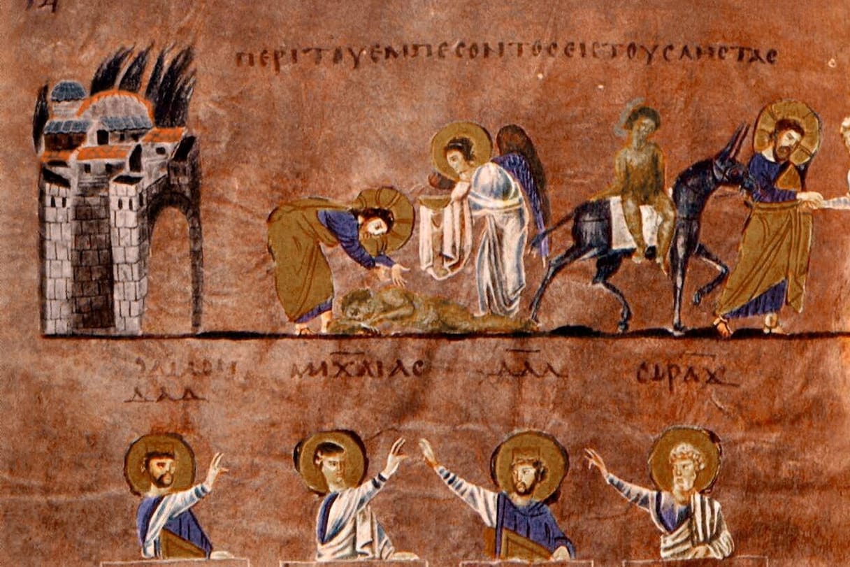 Christ, haloed, bends to tend a wounded man lying by the road outside a walled city, helped by an angel, then leads him on a mule toward an inn; below, four Old Testament prophets raise their hands toward the scene.