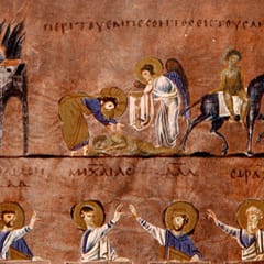 Christ, haloed, bends to tend a wounded man lying by the road outside a walled city, helped by an angel, then leads him on a mule toward an inn; below, four Old Testament prophets raise their hands toward the scene.