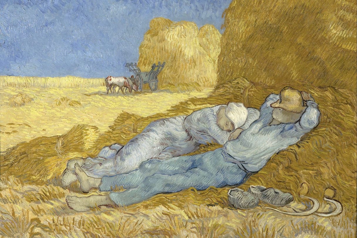 Two farm workers sleep in the shade of a haystack at midday, their shoes and sickles set aside, under a bright blue sky.