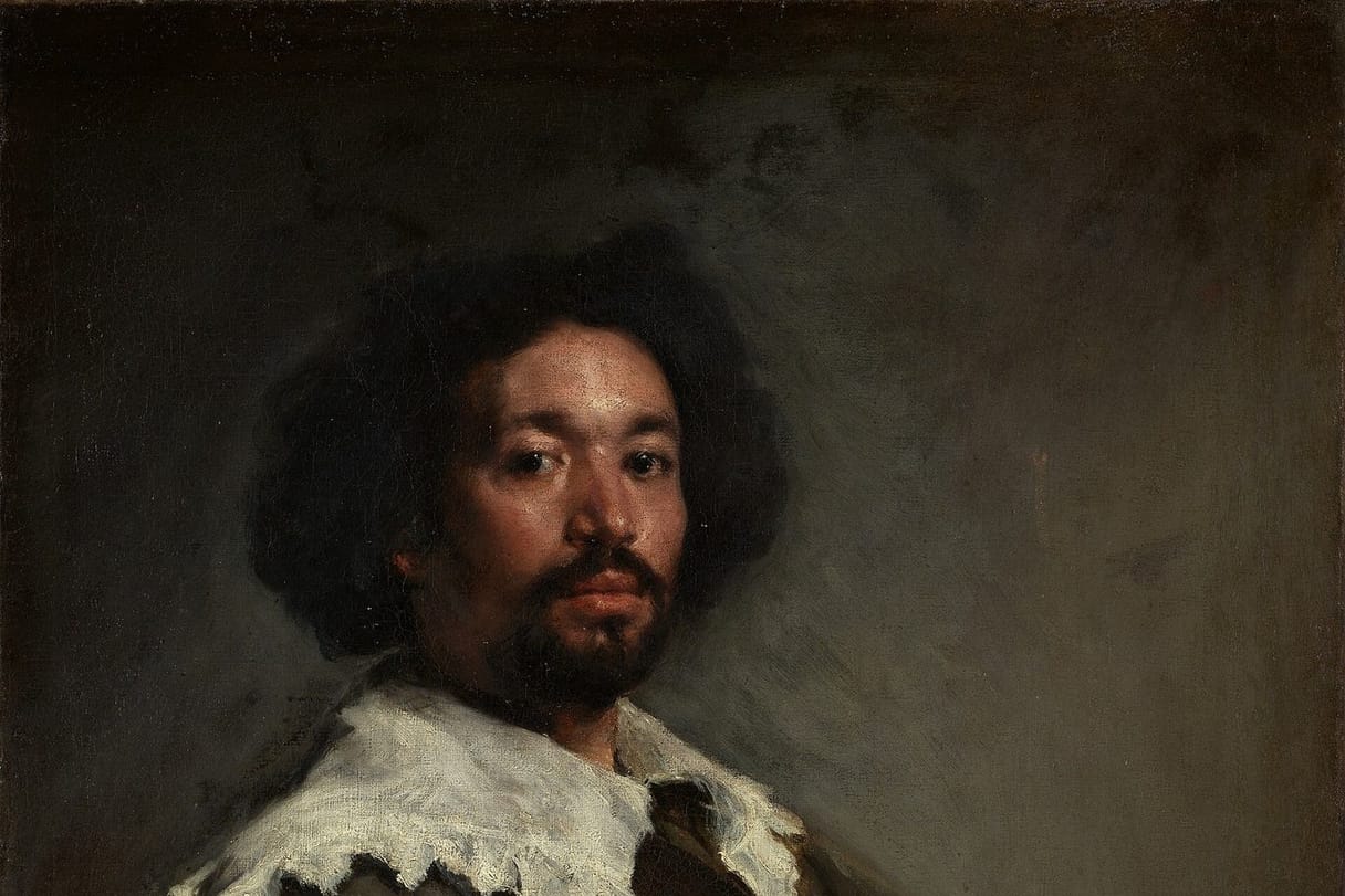 A portrait of the painter Juan de Pareja, a man of African and Spanish descent, who looks out with calm confidence above a white lace collar.