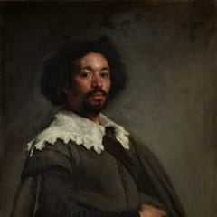 A portrait of the painter Juan de Pareja, a man of African and Spanish descent, who looks out with calm confidence above a white lace collar.