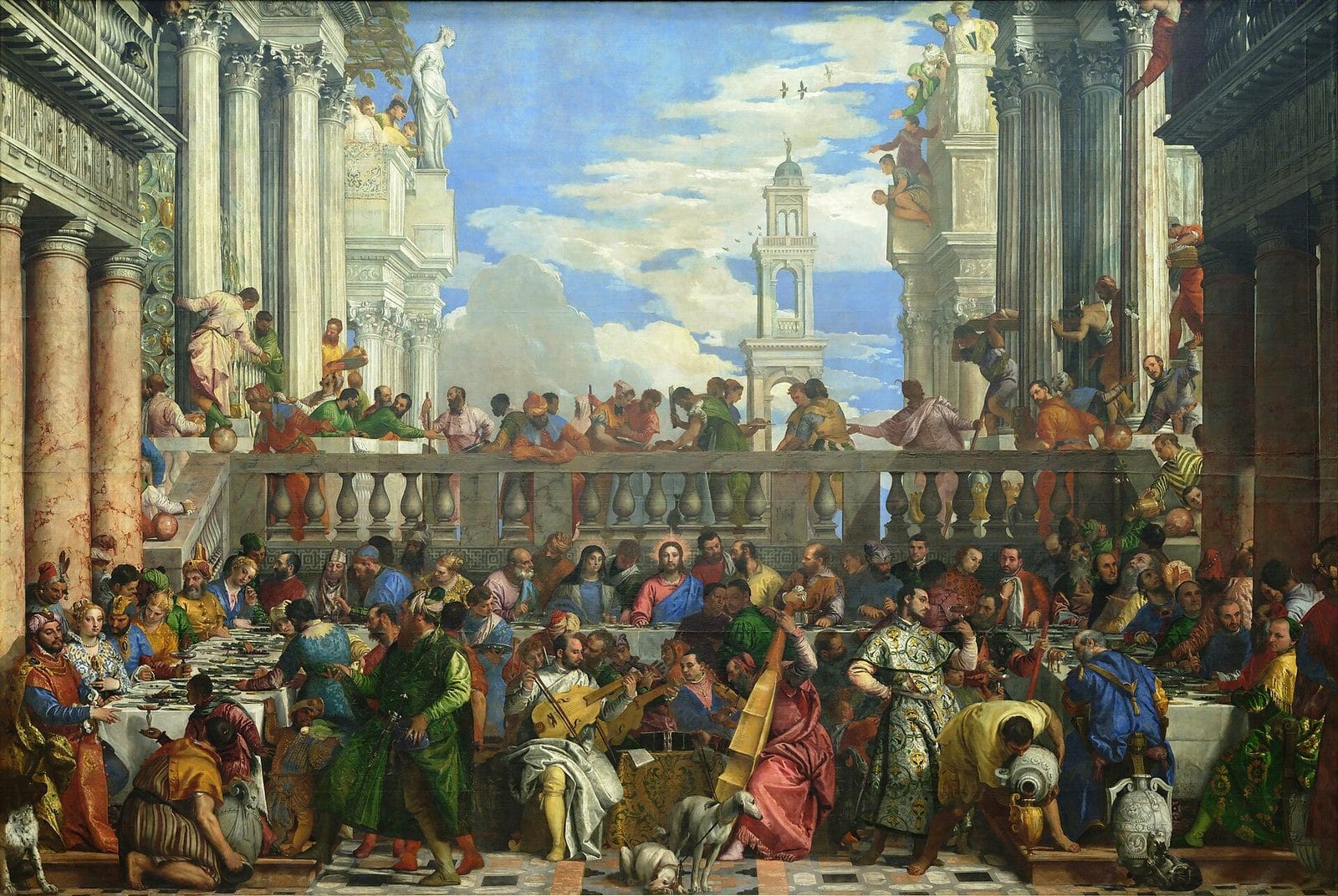A crowded wedding feast fills a marble courtyard under a bright sky, with Jesus seated at the center of the long table as servants pour wine and musicians play.